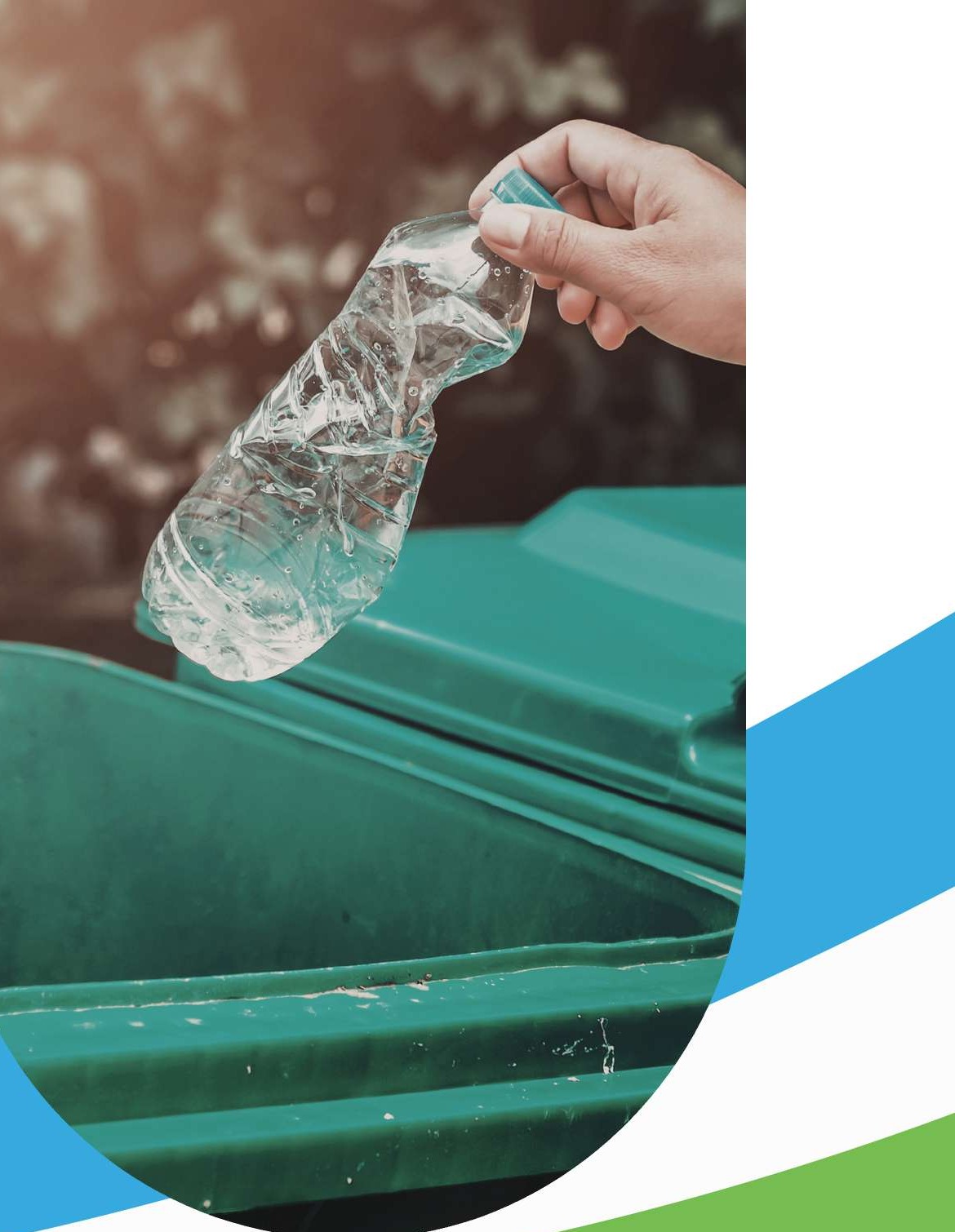 African professional depositing clean plastic bottles into a recycling recovery bin in Uganda
